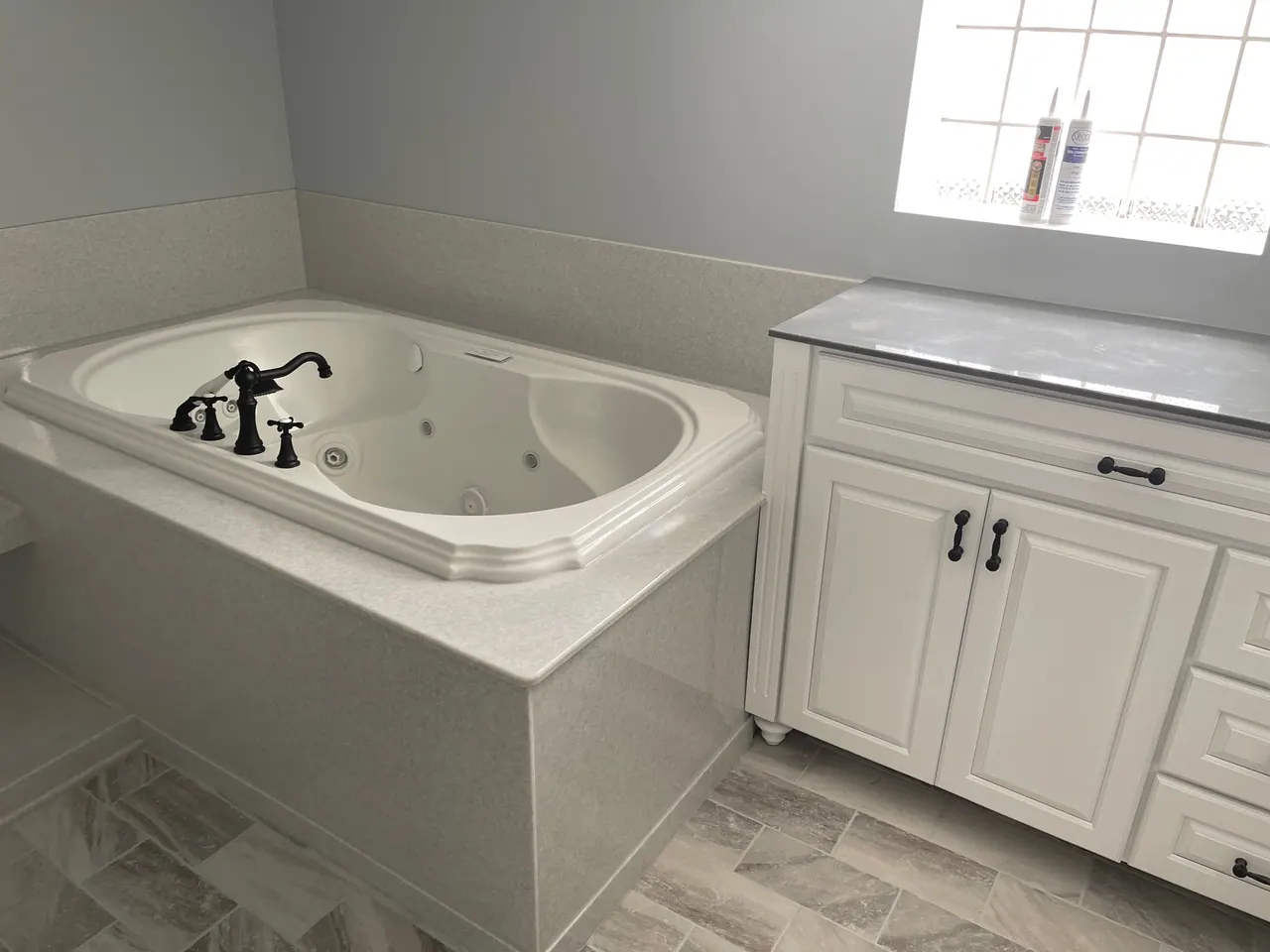 Finished tub and shower with a solid-surface surround, an Excel install in Chicagoland's south suburbs