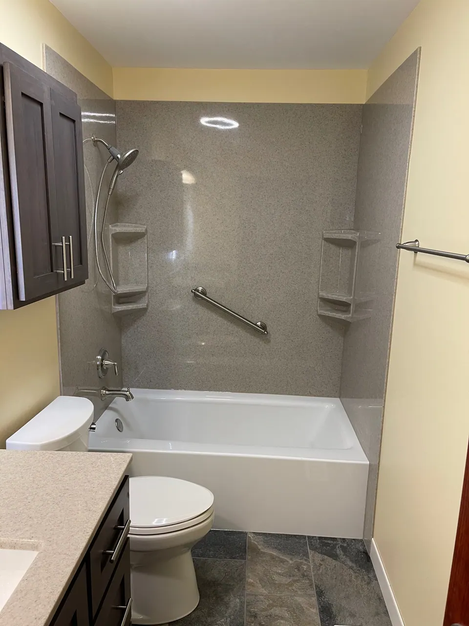 Replacement bathtub-and-shower with a solid-surface surround, niche, and grab bars, Chicagoland