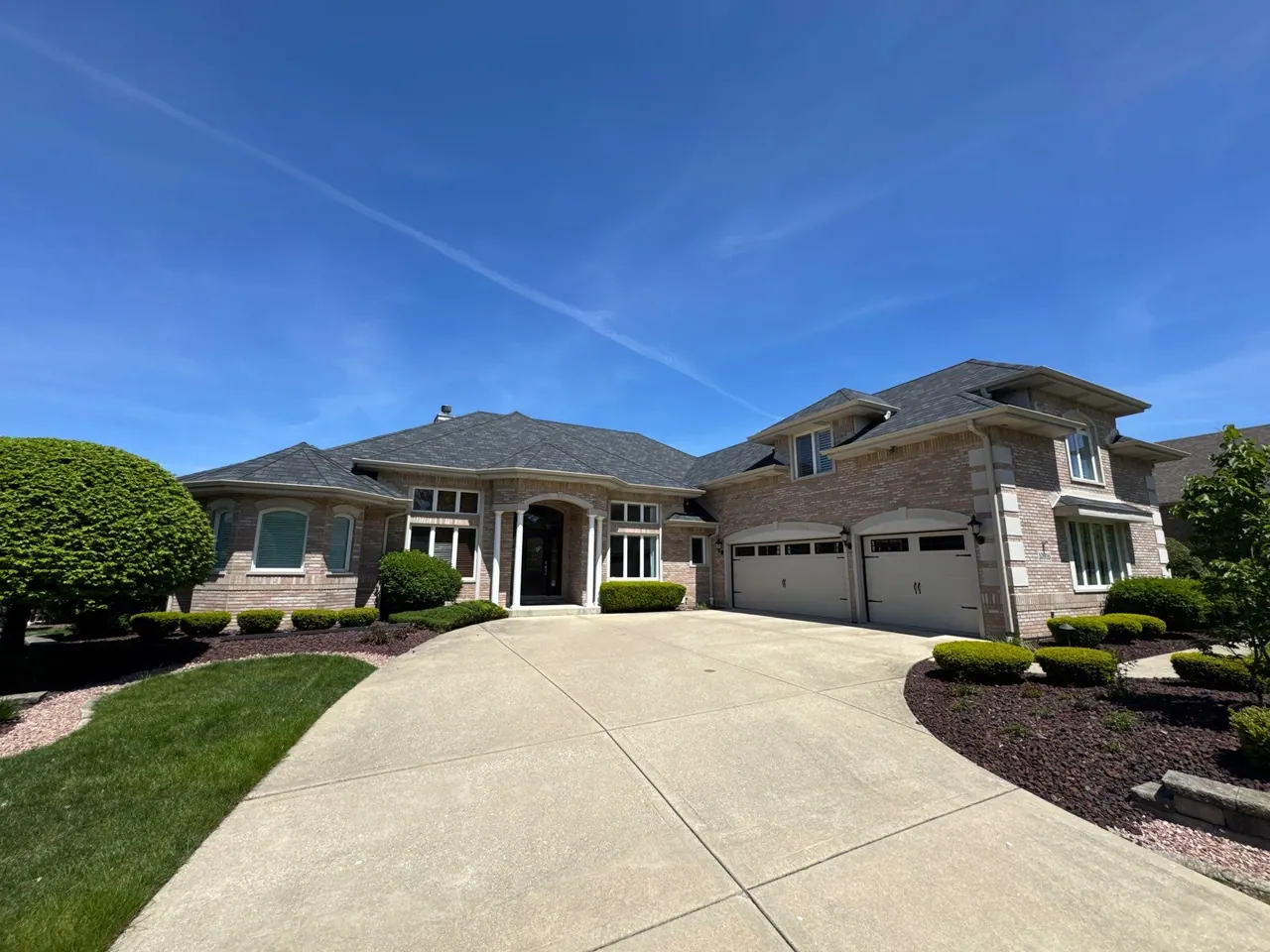 Complete asphalt-shingle roof replacement on a custom brick home, Chicagoland south suburbs