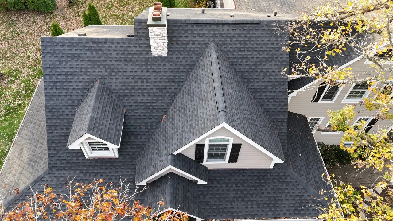 Aerial view of a finished architectural asphalt-shingle roof and dormers, Chicagoland