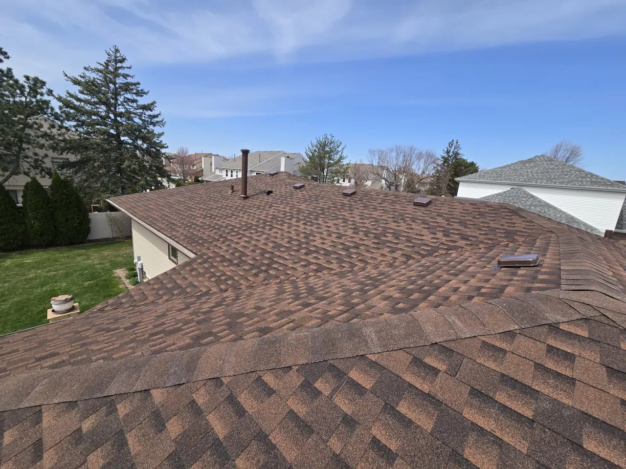 Close-up of a finished asphalt-shingle roof field, Chicagoland