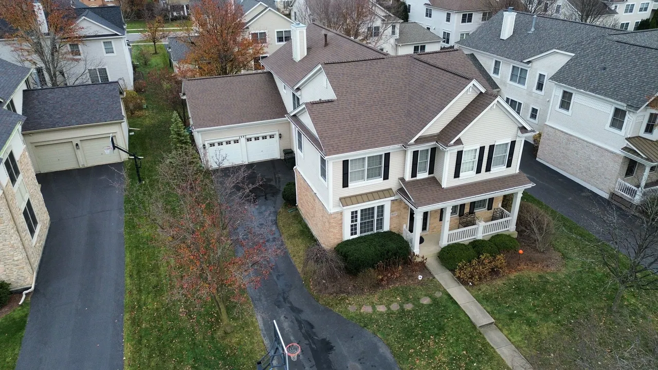 Finished asphalt-shingle roof on a two-story home, Chicagoland south suburbs