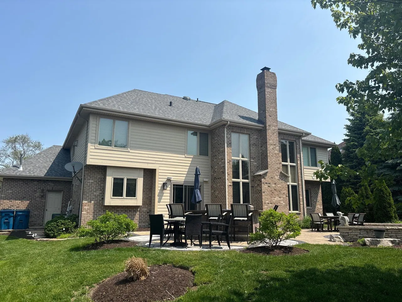 Rear-elevation view of a completed asphalt-shingle reroof, Chicagoland