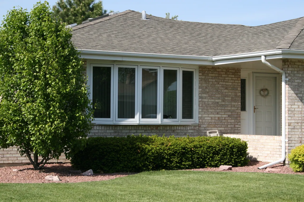 Bay window projecting from a brick home, Chicagoland south suburbs