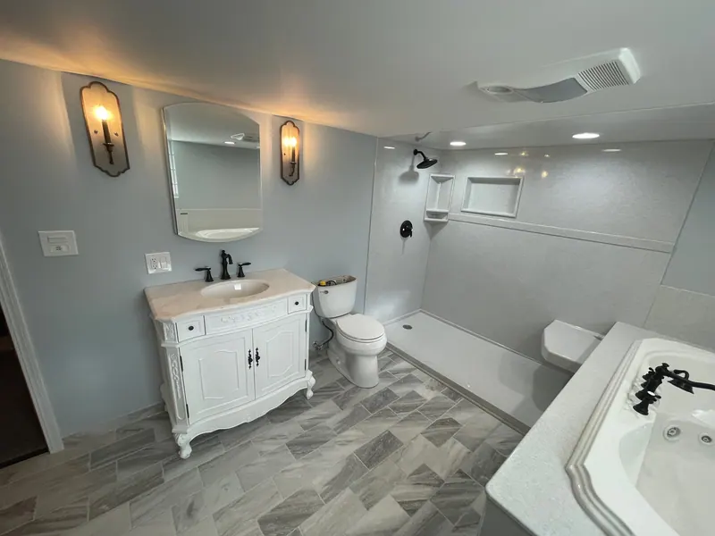 Finished full bathroom remodel with a vanity, solid-surface walls, and tile floor, an Excel install in the south suburbs