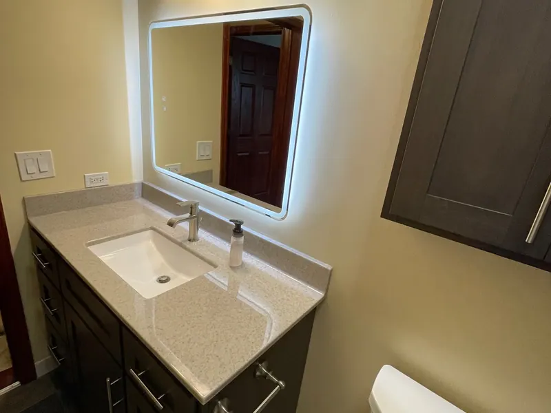 Finished full bathroom remodel with a lighted vanity mirror and a walk-in shower, an Excel install in the south suburbs